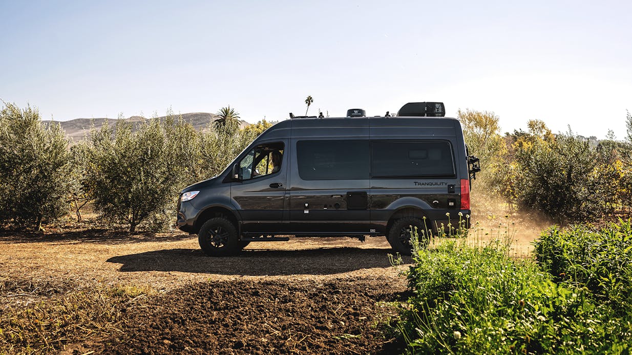 2023 Tranquility Sprinter in charcoal paint driving on dirt road in desert
