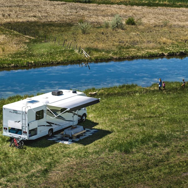 Aerial view of Four Winds class C motorhome beside river